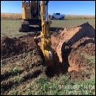 Small image of Backhoe digging